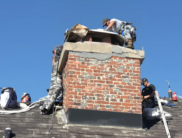 Homestead Chimney Sweep installing a custom chimney crown in Homestead, FL