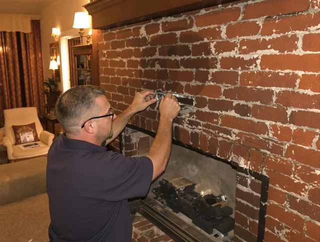 Homestead Chimney Sweep expert fixing a fireplace in Homestead, FL